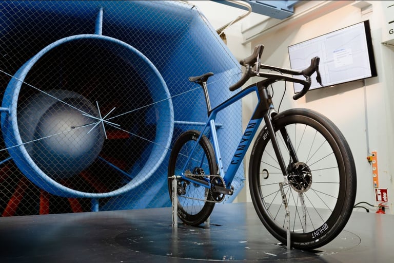 Gravel bike on a turntable before the wind tunnel fan, fitted with Hunt 42 Limitless Gravel Disc wheels.
