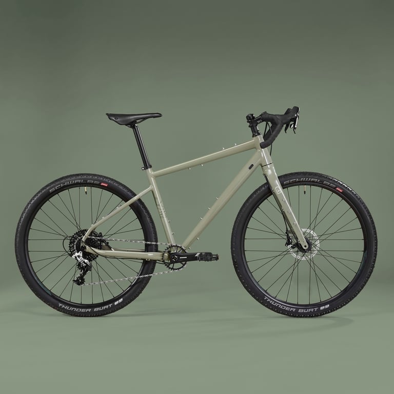 Riverside Touring 920 in sage green with drop bars and Schwalbe Thunder Burt tyres, studio side view.