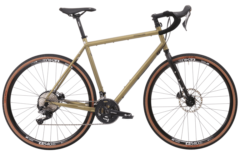 Tout Terrain Vasco GT 28 Select 21.4 with 2X Shimano GRX chainset and steel fork, side view on white.