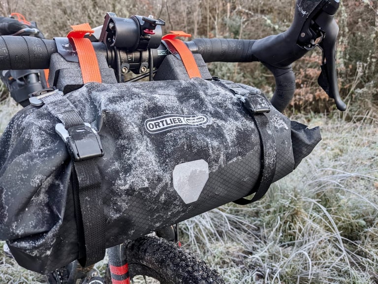 Frosted Ortlieb handlebar bag strapped to drop bars on a winter Festive 500 ride in South Wales.