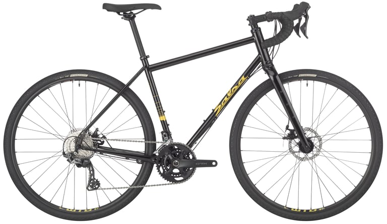 Salsa Vaya GRX 600 steel all-road bike in black with gold decals, side view on white, with Shimano GRX cranks.