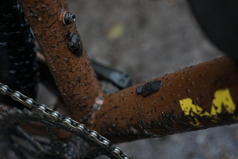 Close-up of rubber bungs covering the internal dropper post ports on the muddy Marin DSX 2 frame.