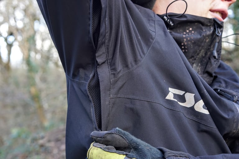 Open pit zip on the TSG Drop Rain Jacket, showing the mesh lining under the arm.