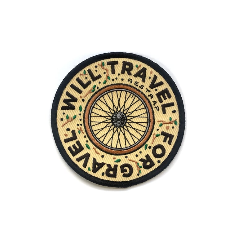 Restrap 'Will Travel For Gravel' embroidered patch with a bike wheel, given to riders who contribute a route.