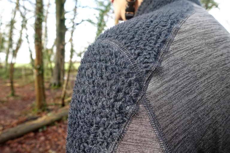 Close-up of the fluffy Polartec Alpha hi loft insulation on the shoulder of the Velocio Alpha jersey.
