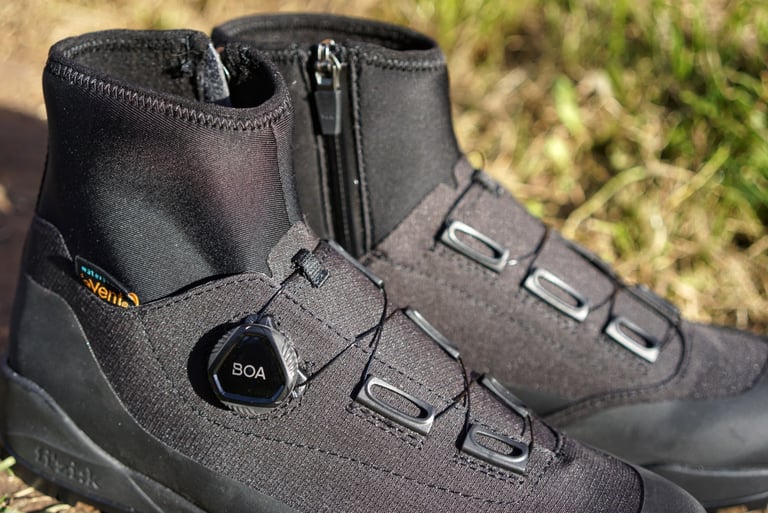BOA L6 dial and wire lace guides on the Fizik Terra Artica X2 boot, with the eVent label and neoprene cuff.