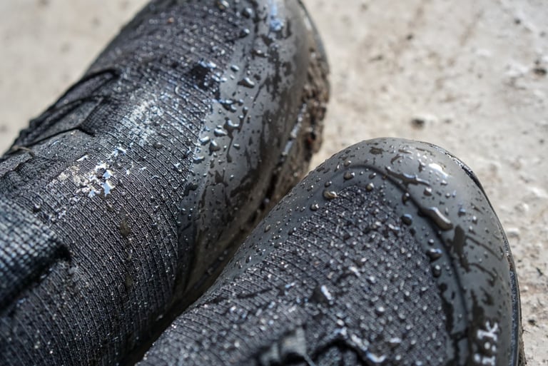 Water beads on the ripstop fabric and rubber toe cap of the Fizik Terra Artica X2 boots after wet riding.
