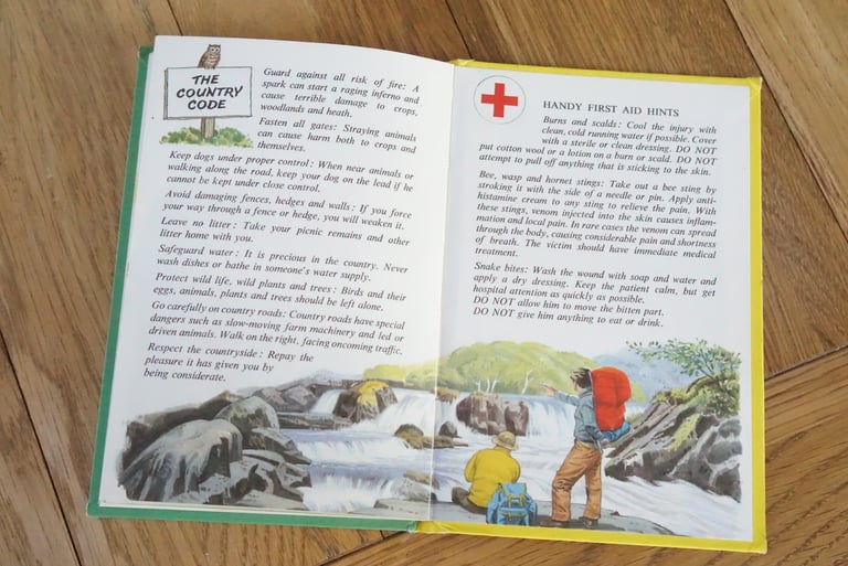 Ladybird camping book page headed The Country Code, beside first aid hints and an illustration of walkers by a river.
