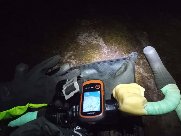 Garmin eTrex 20x GPS and a chunk of marzipan on the handlebars during a night ride on the Glasgow Inner Circle.