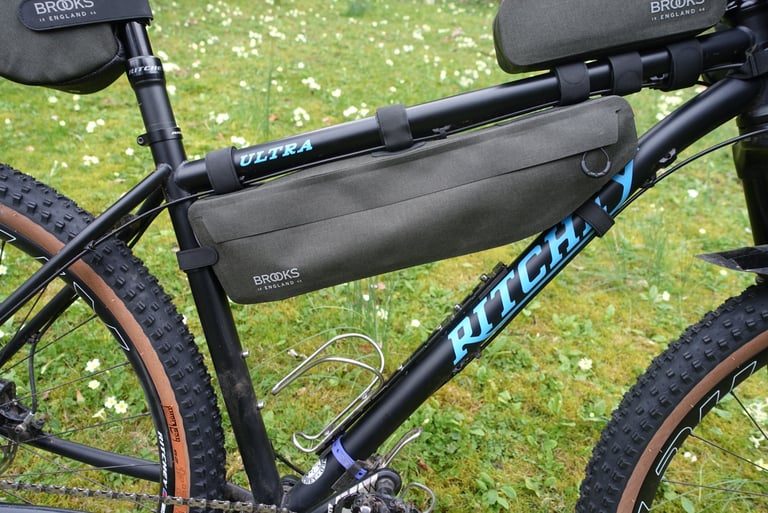 Brooks Scape Frame Bag in grey-green fitted in the front triangle of a Ritchey mountain bike, held by Velcro straps.