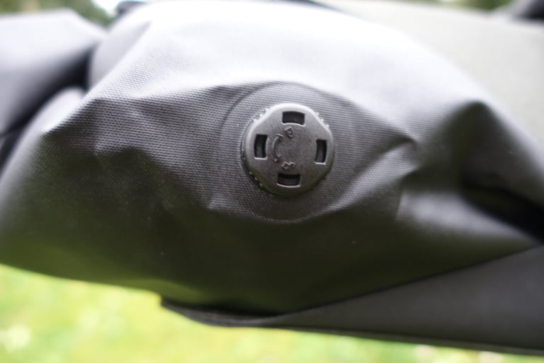 One-way air valve on the black dry bag of the Brooks Scape Seat Bag, used to compress the load.