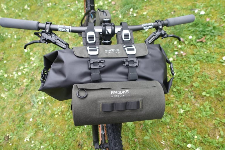 Brooks Scape Handlebar Roll on ENVE bars with the small cylindrical bar bag attached to the front of the holster.