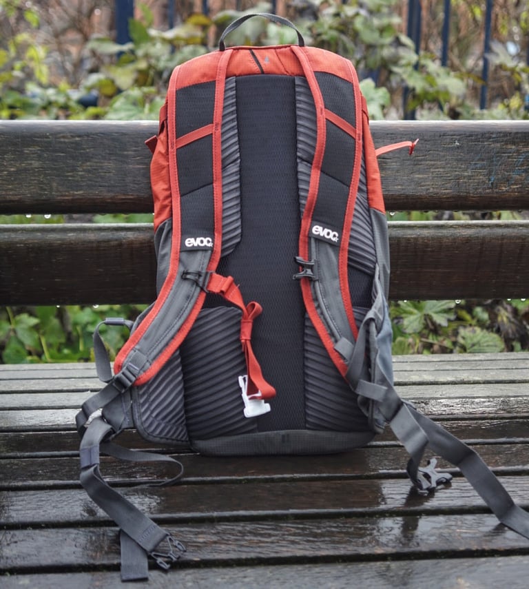 Back panel of the EVOC Ride 12L with four ventilated Air Pad System mesh pads, on a wet bench.