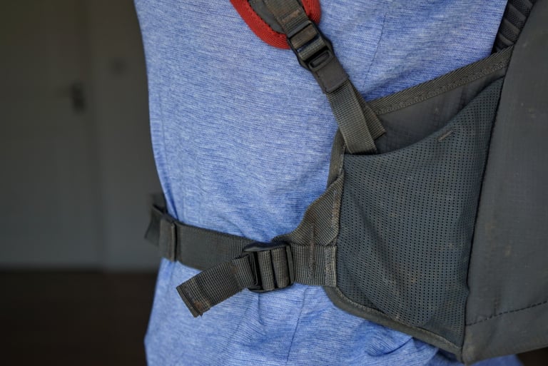 Winged hip belt and mesh pocket of the EVOC Ride 12L, worn on a rider's waist.