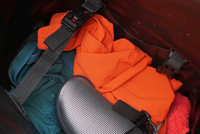 Inside the Ortlieb Handlebar Pack QR, with clothing packed under an internal compression strap.