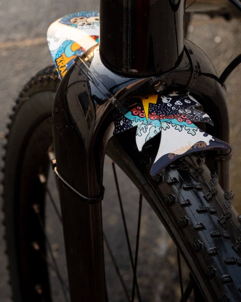 Storm fin on the RideGuard Vision front guard, sitting under the fork crown of a gravel bike above the tyre.
