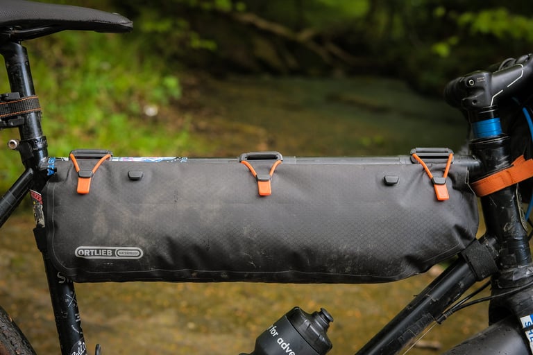Side view of the Ortlieb Frame-Pack RC Toptube filling the main triangle, its three roll-top toggles hooked along the top.