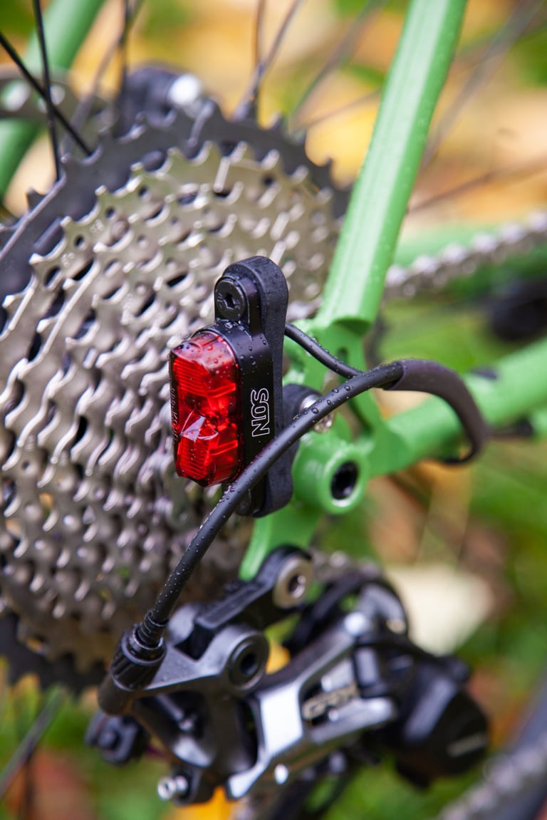 Son rear dynamo light on its 3D printed Nylon mount at the Fairlight Faran 2 dropout, beside the GRX rear mech.