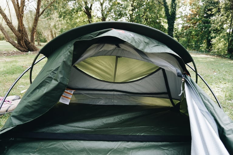 Looking into the open head end of the Alpkit Elan hooped bivvy, with the rear mesh window and inner fabric visible.
