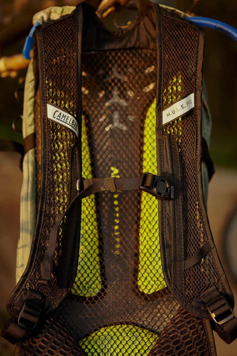 Back panel of the Camelbak Mule Pro showing the mesh Air Support Pro system and padded shoulder straps.
