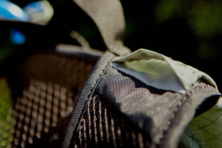 Close-up of a strap and stitched pocket edge on the Camelbak Mule Pro in ripstop fabric.