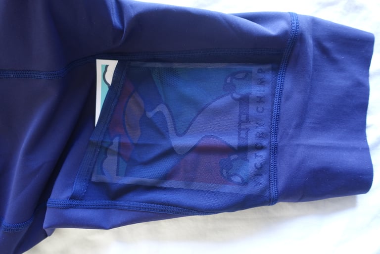 Inside of a Victory Chimp Out There cargo pocket, with a printed illustration showing through the thigh mesh.