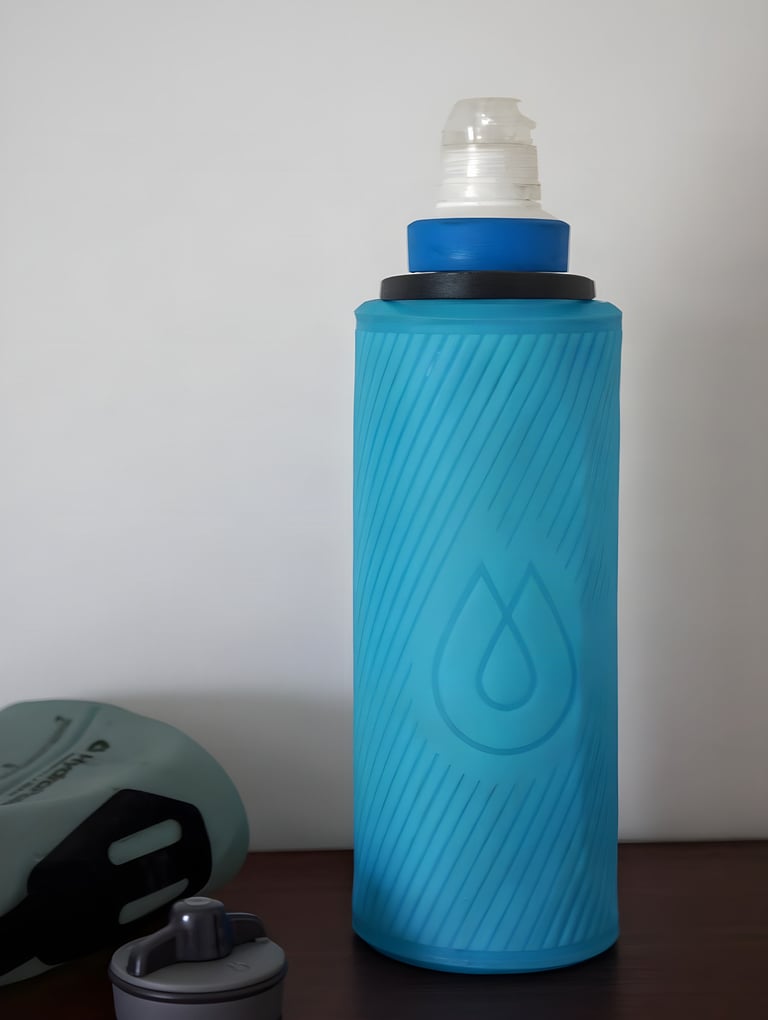 HydraPak Flux 1L soft bottle in blue with a Katadyn BeFree filter screwed into its neck.