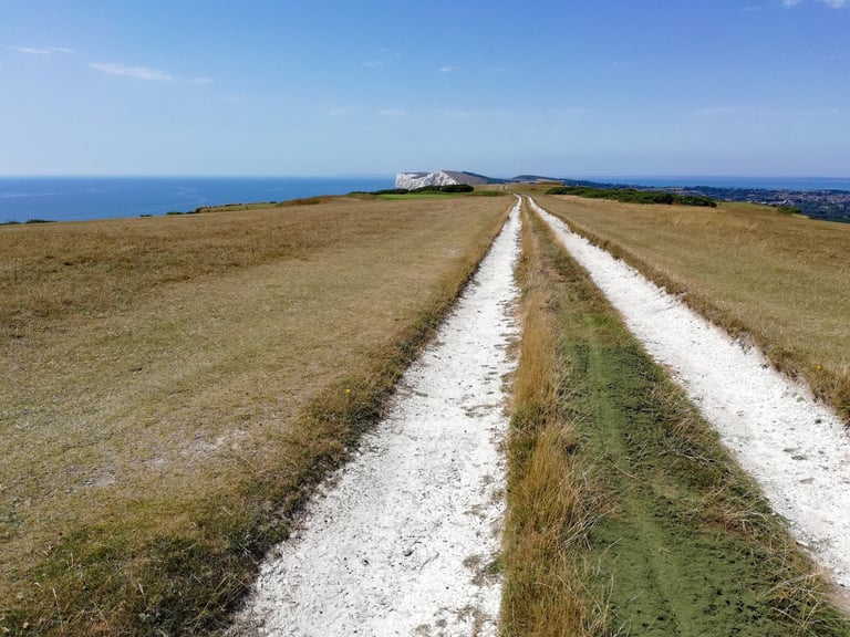 Chalk bridleway crosses open downland towards the sea on the Isle of Wight.