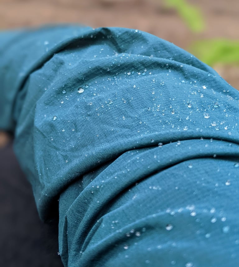 Water droplets beading on the DWR-treated Pertex fabric of the Velocio jacket sleeve.
