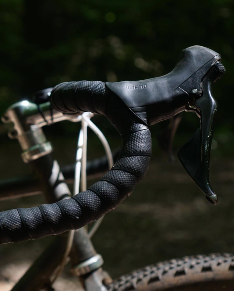 Close-up of a Cowchipper Deluxe drop, with a Shimano lever and grippy tape set at a near-horizontal angle.