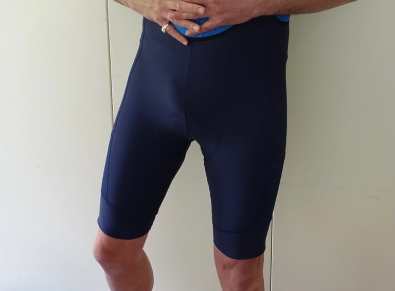 Rider wearing the navy Victory Chimp Out There Cargo Bib Shorts, showing the fit and the length of the leg.