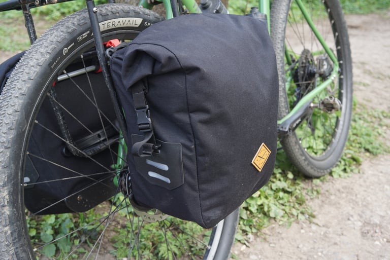 Black Restrap Small 13L pannier with roll-top, reflective strips and the leather-style logo patch.