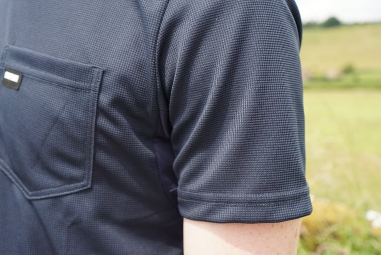 Chapeau Dry Tech Tee sleeve and hem, showing the tidy stitching and textured wicking fabric.