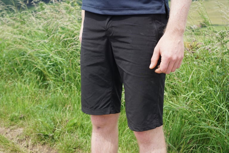 Chapeau Gravel Short in black Phantom, front view, worn with the navy Dry Tech Tee.