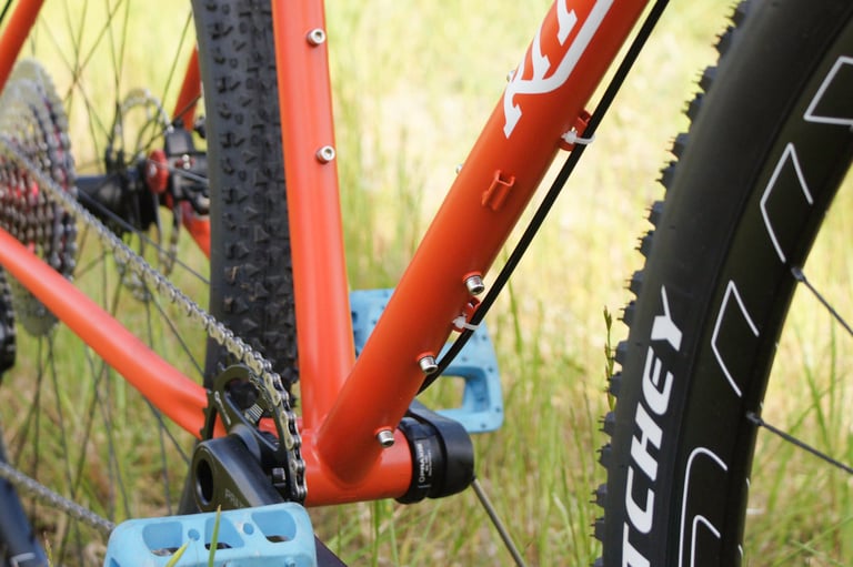 Close-up of the 2021 Ritchey Ascent frame showing bolt-on mounts, bottom bracket and wide tyre.