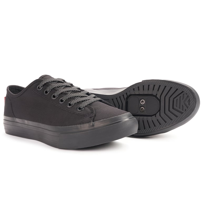 Black Chrome Kursk Pro 2.0 low-top shoe with reflective laces, beside its sole with the SPD cleat recess.