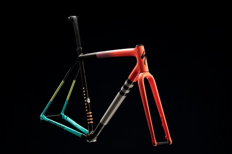 2021 Specialized Crux Pro frameset in red, black, grey and teal with a matching fork, shown on a black background.