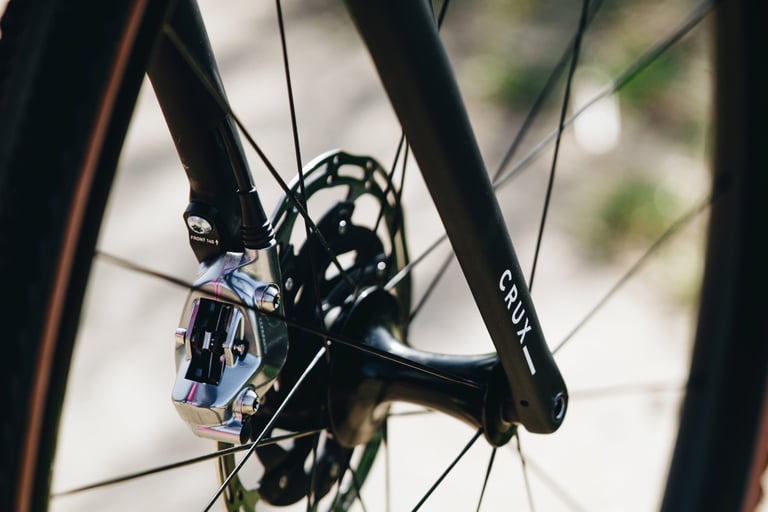 Specialized Crux carbon fork with Crux branding, flat-mount disc brake caliper and thru-axle hub.
