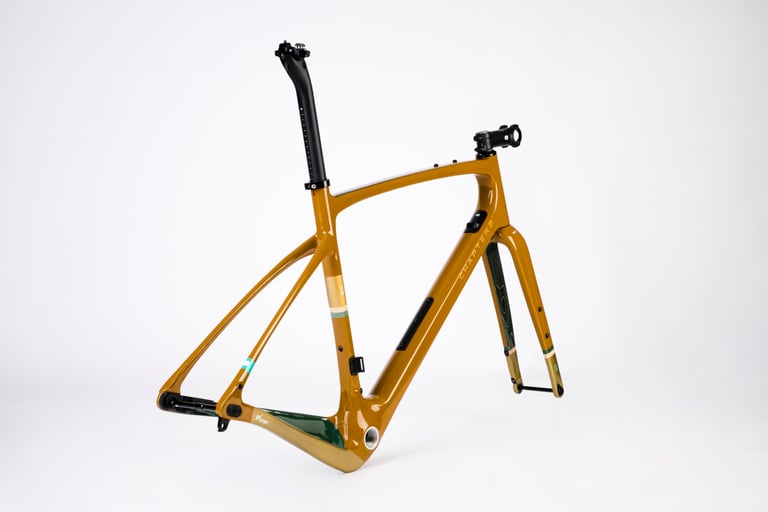 Side view of the bronze Chapter2 AO Rangipo gravel frameset with fork, seatpost and stem fitted.