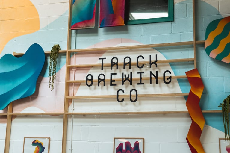 Track Brewing Co sign on a painted brick wall in the taproom where the Gravel Bonanza finished.