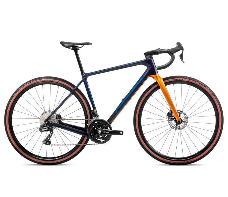 Orbea Terra M21i Team in blue and orange with Shimano GRX 2x and Pirelli tan-wall tyres, side view.