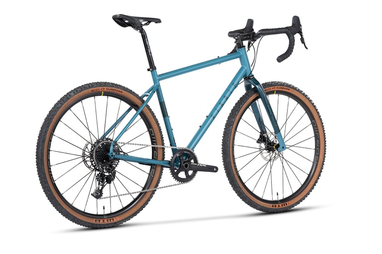 Ribble Gravel 725 Sport with SRAM Apex 1 and tan-wall WTB Sendero tyres, rear three-quarter view on white.