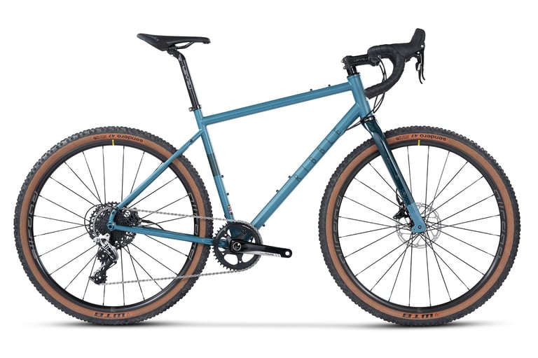 Ribble Gravel 725 Enthusiast in blue with SRAM Rival drivetrain, side view on white.