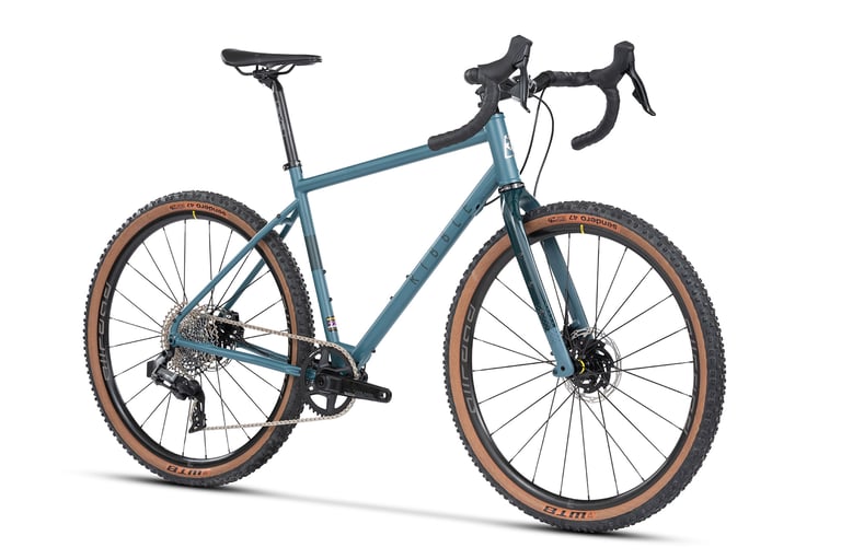 Ribble Gravel 725 Pro in blue with 1x12 SRAM Rival XPLR AXS shifting, front three-quarter view on white.