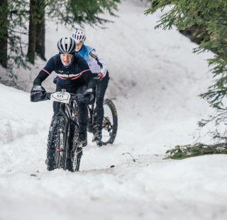 Snow Bike Festival Stage 3 in the trees by Wayne Reiche
