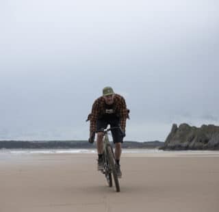 The Overland solo rider on beach